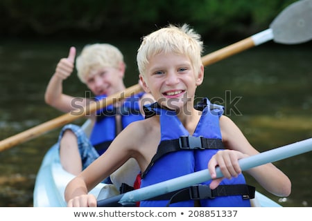 Foto stock: Family In A Canoe On A Lake Having Fun