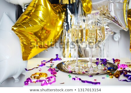 Foto d'archivio: Close Up Of Shiny Glasses Of Champagne Over Black White Golden