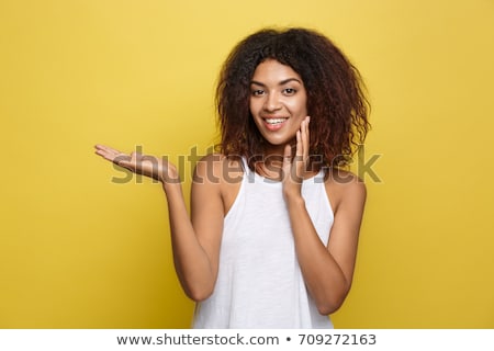 Foto stock: Happy African Woman Holding Something Imaginary