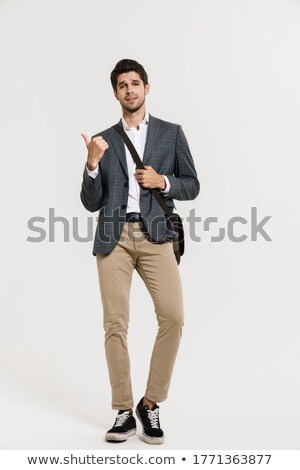 [[stock_photo]]: Image Of Optimistic Businessman 30s In Formal Suit Pointing Fing