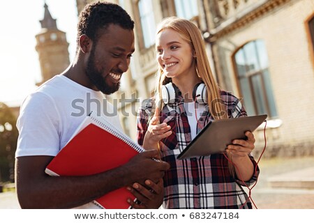 Stock fotó: Young Woman Explaining Something To A Friend
