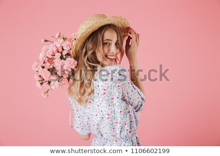 Stok fotoğraf: Portrait Of A Cheerful Young Girl In Dress And Straw Hat
