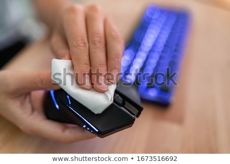 Man Wiping Keyboard With Sanitizer Foto stock © Maridav