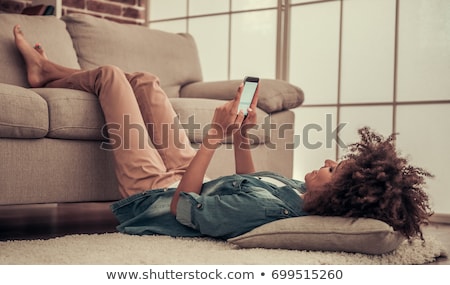 Stock photo: Woman Using Her Mobile Smart Phone At Home