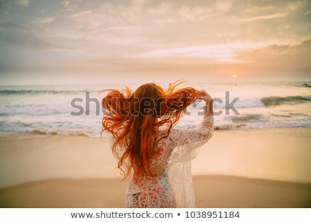 Stock fotó: Woman With Red Hair At The Beach