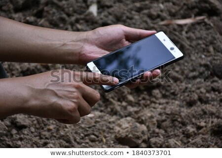 Сток-фото: Female Farmer Holding Smartphone With Blank Mock Up Screen
