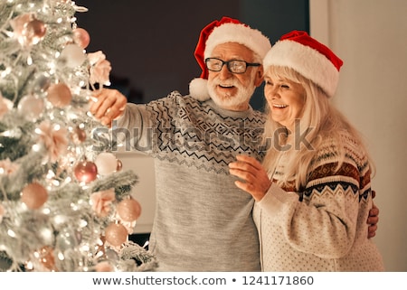 Stock foto: Woman With An Ornamented Christmas Ball