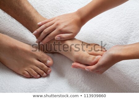 Zdjęcia stock: Therapist Giving Foot Massage To Man