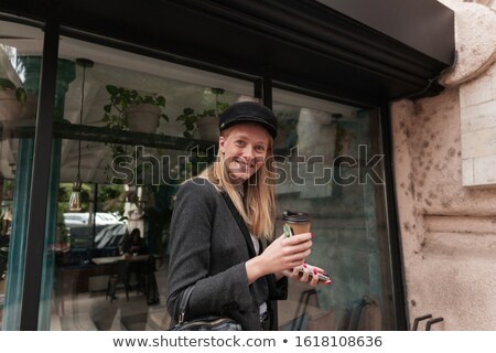 Foto stock: Photo Of Cheerful Young Woman Wears Elegant Clothes Dressed In White Jumper And Black Trousers Dri