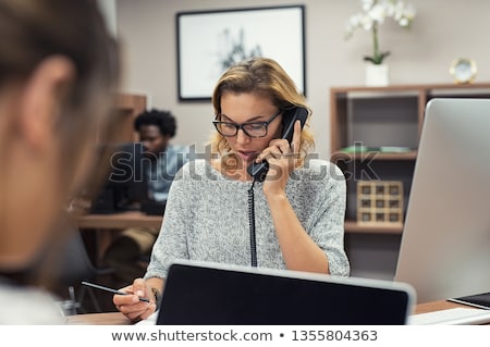 Stockfoto: Receptionist Taking A Call