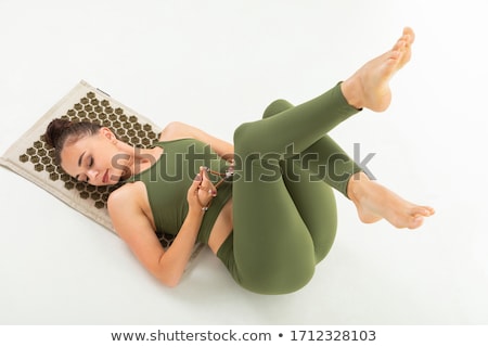 Stock foto: Fit Brunette Lying On Towel