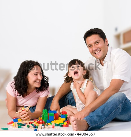 Zdjęcia stock: Happy Family Playing With Colorful Blocks At Home