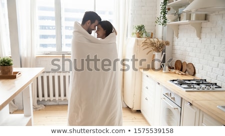 Stock fotó: Young Couple Wrapped In Plaid