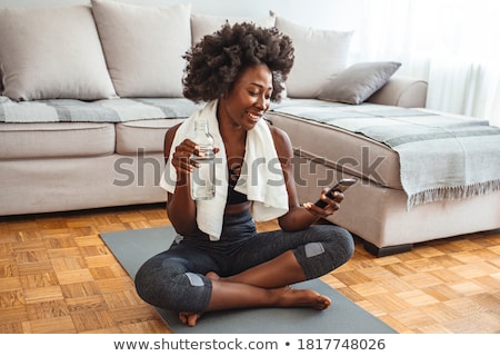 Zdjęcia stock: Woman With Smartphone Resting After Home Cleaning