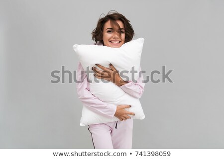 Stock fotó: Smiling Woman Holding A Pillow