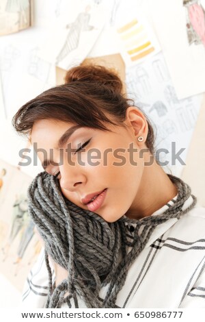 Foto stock: Lovely Girl Holding Yarn For Knitting Close To Her Face