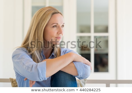 Stock fotó: Thoughtful Woman Relaxing In Porch
