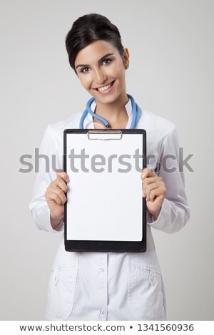 Stock photo: Woman Doctor Or Nurse Showing Empty Blank