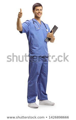 Stock fotó: Full Length Young Smiling Male Doctor Showing Clipboard With Cop