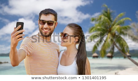 Stockfoto: Woman Taking Selfie By Smartphone On Bora Bora
