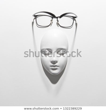 Сток-фото: Stylish Glasses With Black Frame For Reading Daily Life On A Gypsum Face Sculpture On A White Backgr