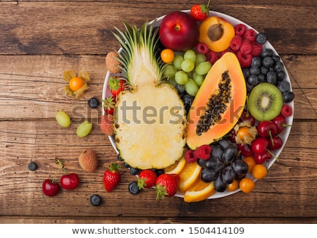 [[stock_photo]]: Fresh Raw Organic Summer Berries And Exotic Fruits In White Plate On Vintage Wooden Background Pine