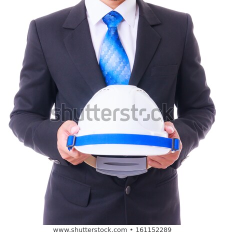 Stockfoto: Portrait Of Relaxed Businessman Wearing Safety Helmet Holding Bl