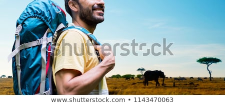 Stok fotoğraf: Close Up Of Man With Backpack Over Savannah