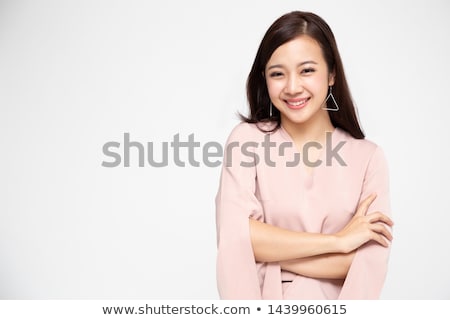 Stok fotoğraf: Portrait Of A Smiling Asian Woman In Dress