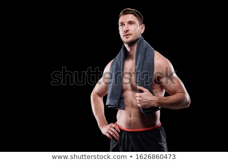 [[stock_photo]]: Active Young Muscular Shirtless Man With Towel On Neck Keeping One Hand On Waist