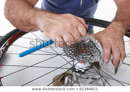 Stock photo: Cyclistbiker Taking Care Of His Bike