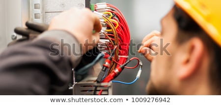 Foto stock: Electrician With A Voltmeter