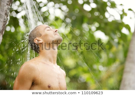 Zdjęcia stock: Man Has A Shower In The Garden