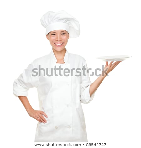 Young Woman In Chef Uniform Showing An Empty Plate Stock foto © Maridav