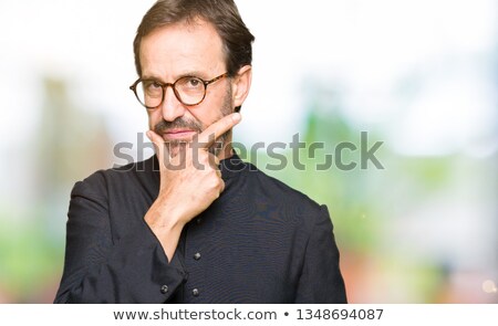 Foto stock: Portrait Of Happy Catholic Priest Smiling At Camera In Church