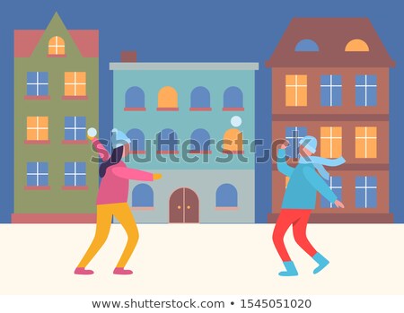 Stock photo: Girl And Boy Having Fun With A Snowball Battle