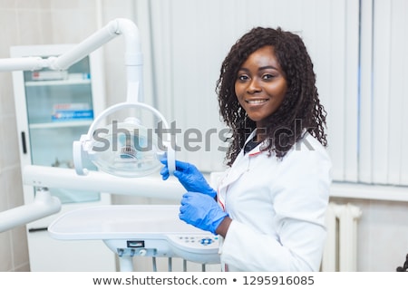 Foto stock: Female Dentist With Dental Equipment At Surgery