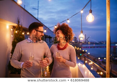 Stok fotoğraf: Group Of Friend Having Champagne In Balcony