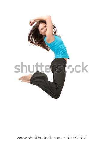 Foto d'archivio: Happy Smiling Sporty Young Woman Jumping In Air