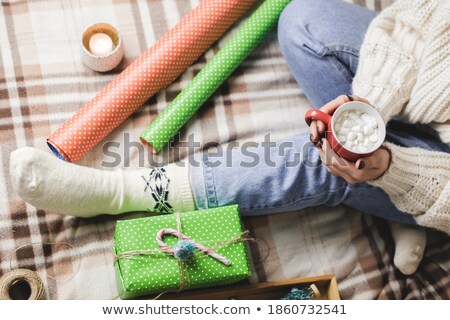 Foto stock: Woman Holding Paper Green Foot