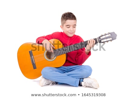 Zdjęcia stock: A Teenage Boy Playing A Guitar