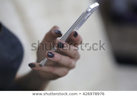 Сток-фото: Businessman S Hand Holding A Phone Colorful Banner