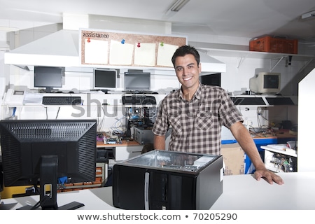 Professional Repairman Repairing Computer In Workshop Imagine de stoc © mangostock