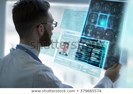 [[stock_photo]]: Hospital Workers With Scans And Xrays Of Patients