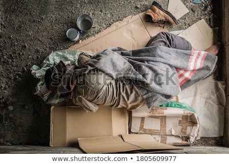 [[stock_photo]]: Homeless Beggar Sleeping