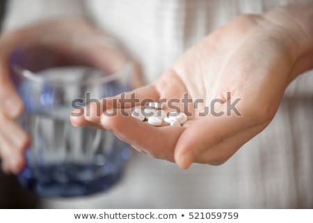 Foto stock: Woman With Heap Of Pills