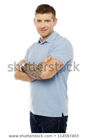 Imagine de stoc: Stylish Man With Tattoo On Hand Posing With Folded Arms