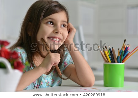 Zdjęcia stock: Happy Little Girl Drawing With Pencils At Home