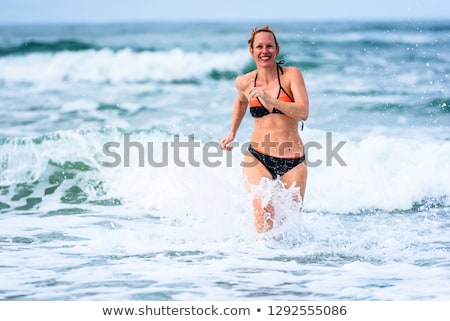 Stockfoto: Woman In Bathing Suit Jump In Joy