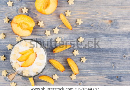 ストックフォト: Colorful Healthy Breakfast With Corn Flakes Ripe Slice Peach On Blue Wood Board Decorative Border